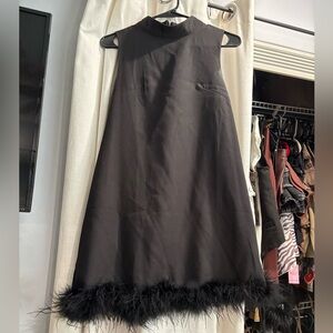 Black dress with faux fur/feather trim